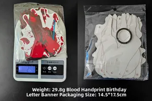 Detail view showing weight and packaging of the bloody handprint Halloween banner set