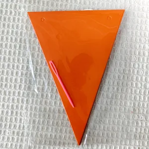 Detail of orange triangle bunting pennants with pink threading needle in clear packaging