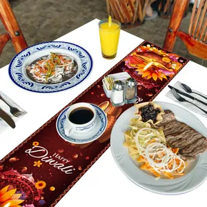 Deep red Happy Diwali table runner with traditional mandala and diya oil lamp patterns