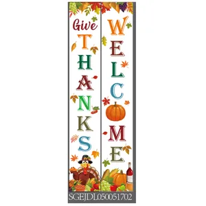 Detailed view of Give Thanks and Welcome porch banners with turkey and pumpkin motifs