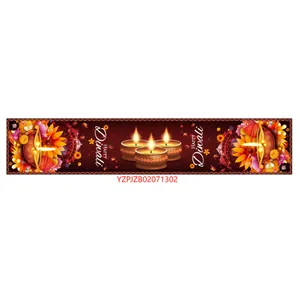 Close-up of Diwali table runner with Happy Diwali text and traditional diya oil lamp motifs
