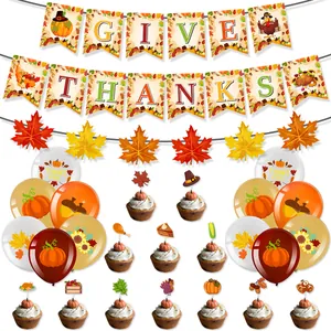 Thanksgiving party kit with 'GIVE THANKS' banners, maple leaves, and turkey cake toppers