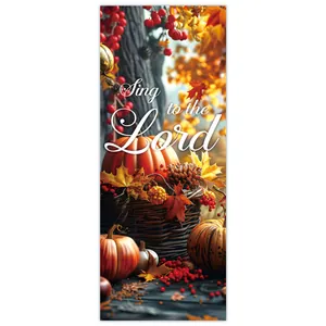 Detail of harvest banner showing pumpkins, red berries, and maple leaves with religious text