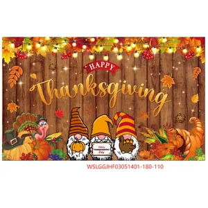 Detail of Thanksgiving backdrop with festive gnomes, pumpkins and warm string lights