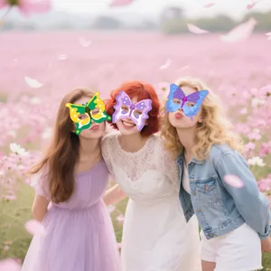 Close-up of paper butterfly masks in yellow, pink, and blue for girl birthday party