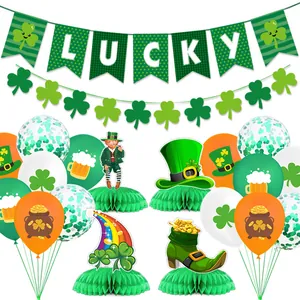 Detailed set of St. Patrick's Day party decorations with clover banners and honeycomb centerpieces