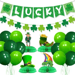 St. Patrick's Day party set with Lucky banner, shamrock garlands, and honeycomb centerpieces