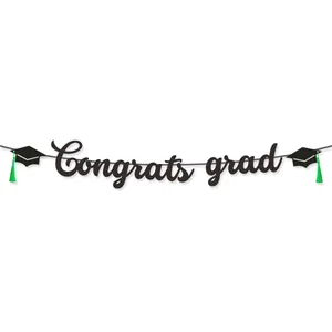 Black glitter Congrats Grad banner with green tassels for 2026 graduation party decor