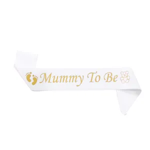 White satin Mummy To Be sash with gold glitter text and teddy bear for baby shower