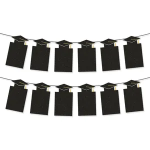 Black glitter graduation banner with 12 mortarboard caps and gold tassels for party decor
