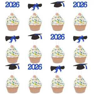 Close-up of 2026 graduation glitter cake toppers with cap and diploma on cupcakes
