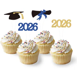 Glittery 2026 graduation cupcake toppers with black mortarboard and diploma scrolls
