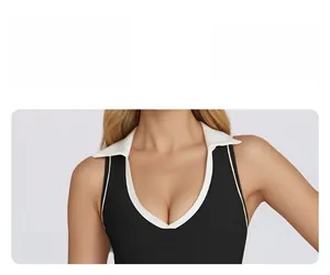 Detail view of the V-neck contrast collar design on a black sleeveless yoga top