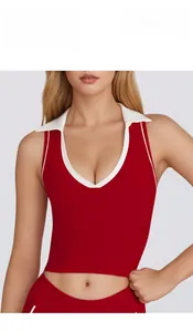 Detail of red sports vest with white polo collar and contrast trim for yoga and tennis