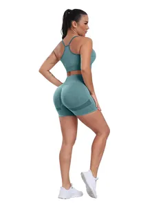 Detail view of teal seamless high-waist sports shorts with ergonomic textured patterns