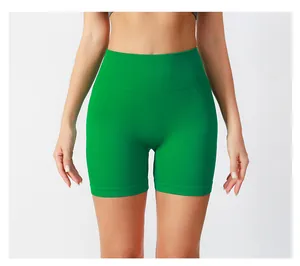 Detail of high-waisted green seamless ribbed yoga shorts with moisture-wicking texture