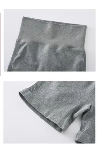 Close-up of seamless gray ribbed waistband and fine stitching on high-waist yoga shorts