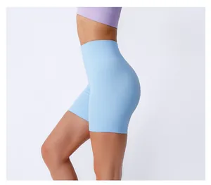 Detail of high-waisted ribbed yoga shorts in light blue with seamless knitting texture