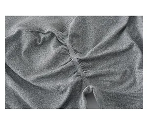 Detailed view of the scrunch butt seam and heather grey knit texture of gym shorts
