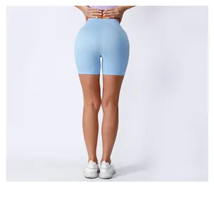Rear view detail of high-waisted ribbed yoga shorts in light blue with seamless fit