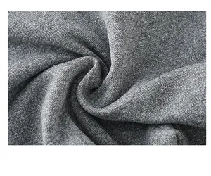 Macro shot of soft heather grey knitted yoga shorts fabric with peach-fuzz texture