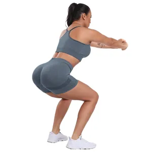 Dark grey seamless high waist yoga set with ribbed sports bra and peach lift shorts