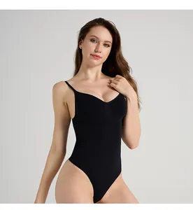 Detail of black V-neck bodysuit showing thin straps and seamless compression fabric