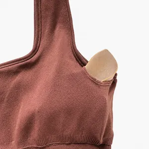 Detail view of removable chest pads inside the seamless stretch yoga bodysuit
