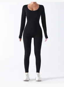 Detailed view of black long-sleeve ribbed seamless yoga bodysuit for fitness training