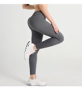 Detail shot of grey ribbed high waist yoga leggings showing seamless compression fabric