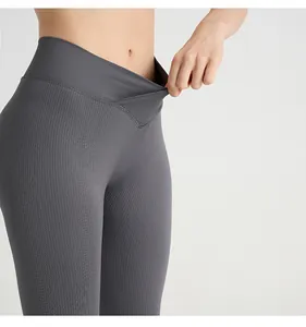 Macro shot of grey ribbed yoga pants featuring high-elastic V-cross waistband design