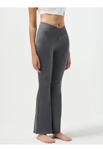 Close-up of ribbed texture and V-shaped crossover waistband on grey yoga pants