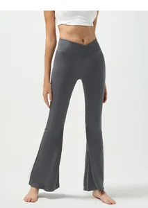 Macro detail of high-waist V-cut ribbed yoga pants with flared fit in dark gray