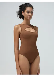 Close-up of brown ribbed bodysuit featuring a seamless high neck and chest cut-out detail