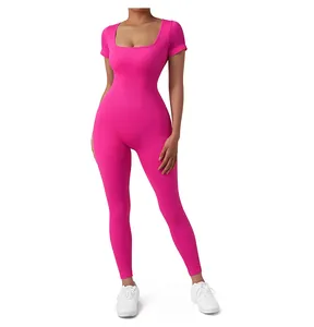 Detailed texture of rose pink ribbed seamless yoga bodysuit with square neckline