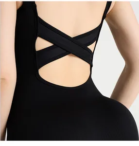 Close-up of the cross-strap back design on black ribbed knit workout bodysuit