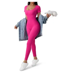 Detailed ribbed texture of hot pink short sleeve yoga jumpsuit with a square neckline