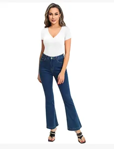 Close-up of white V-neck short sleeve bodysuit paired with flared denim pants