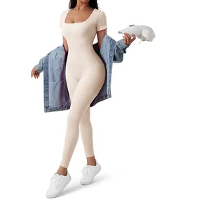 Detailed view of beige ribbed one-piece bodysuit with U-neck and short sleeves design