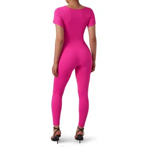 Back view of pink short sleeve ribbed yoga jumpsuit for seamless fitness workout