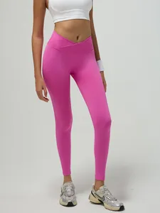 Leggings yoga senza cuciture a vita alta con incrocio a V in rosa vivace