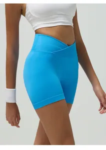 Macro detail of royal blue seamless yoga shorts featuring a crossed V-waistband and ribbed texture