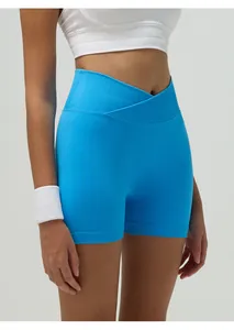 Detailed view of bright blue high-waist yoga shorts with a crossover ribbed waistband