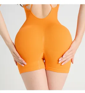 Macro detail of orange ribbed fabric and cross strap back design on yoga bodysuit