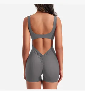 Detail of the open back cutout and scrunch butt lifting effect on dark grey yoga bodysuit