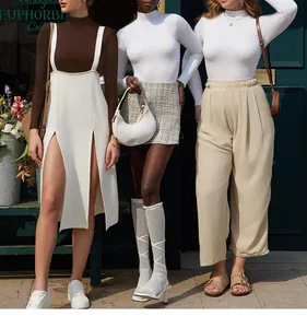 Detailed close-up showing high neck ribbed bodysuits and side slit skirt in autumn style