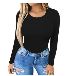 Detail of the slim fit black long sleeve bodysuit with crew neck and elastic fabric