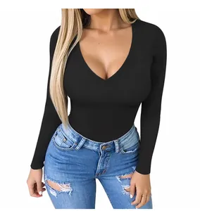 Detail of black deep V-neck long sleeve bodysuit paired with blue ripped jeans for casual wear