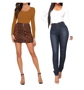 Detail view of crewneck long sleeve tops paired with leopard skirt and skinny jeans