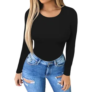 Slim fit long sleeve crew neck yoga bodysuit in black, shown with denim jeans on model